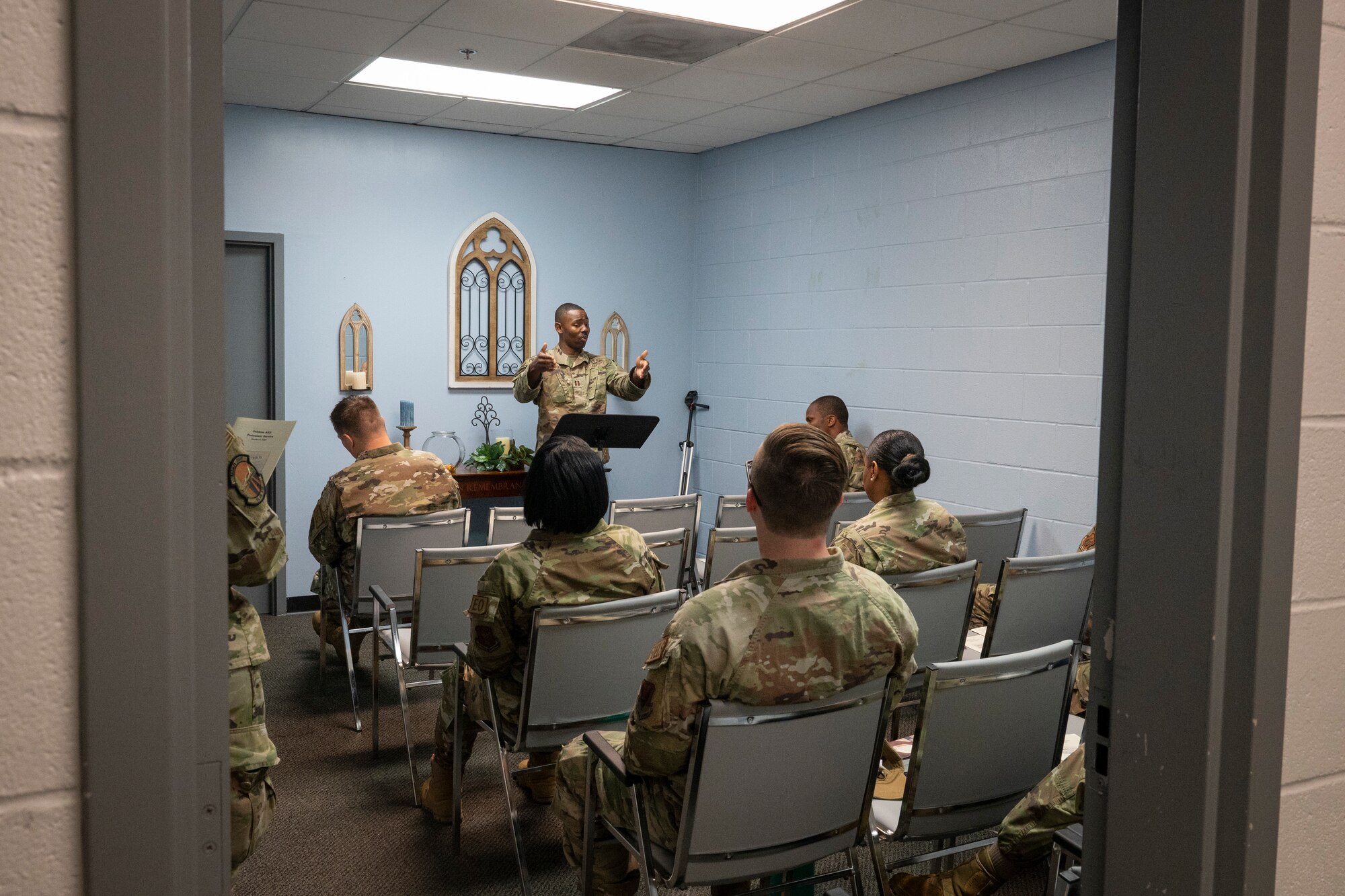 A man gives a sermon/lesson.