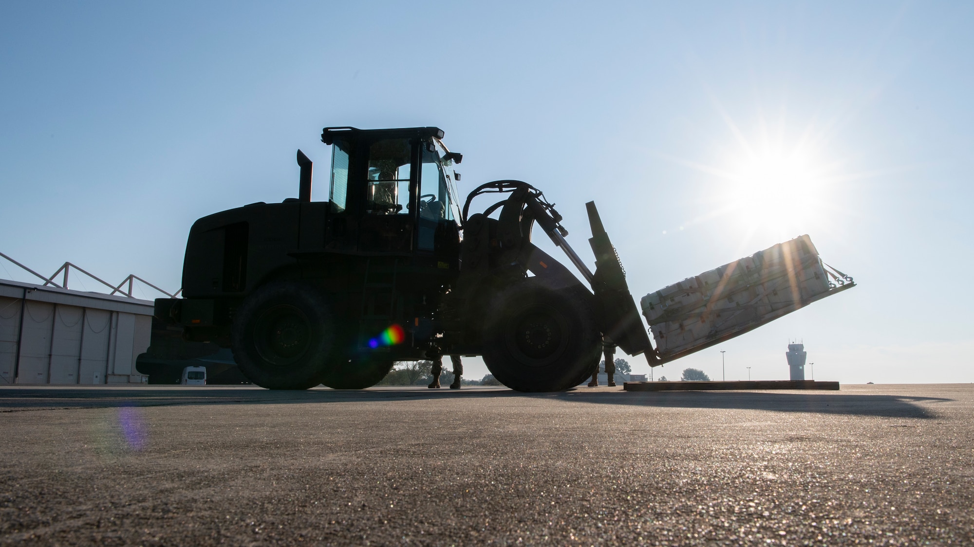 A forklift lifts a pallet.