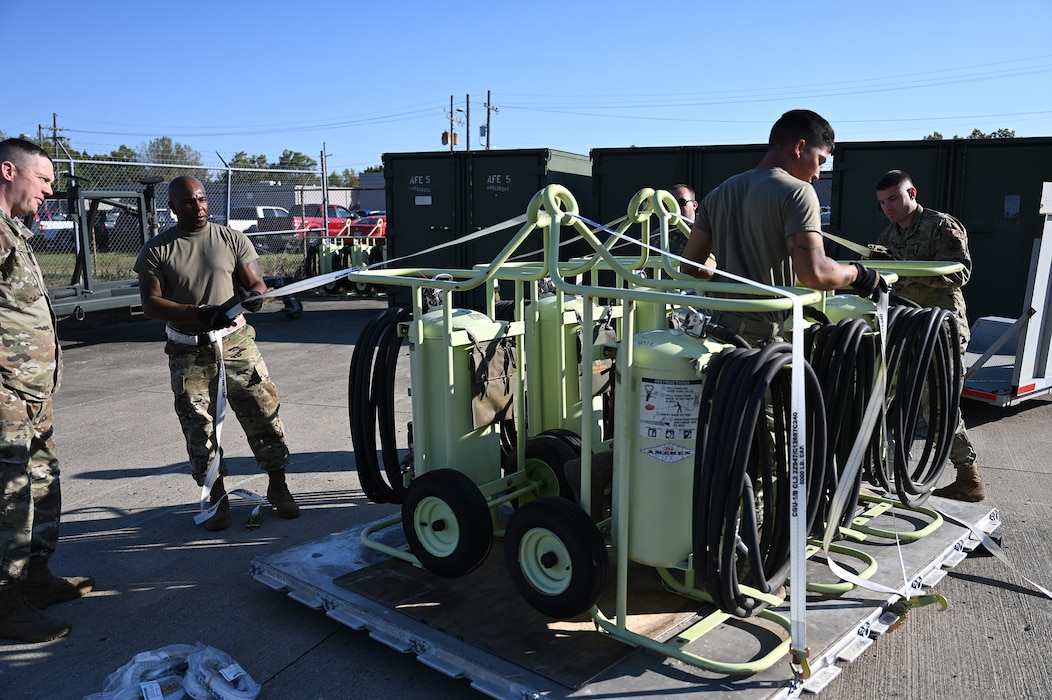 Members of the 445th Logistics Readiness Squadron and 445th Maintenance Squadron aerospace ground equipment secure six 150-pound halon fire extinguishers during pallet building training at Wright-Patterson Air Force Base, Ohio, Sept. 15, 2024.