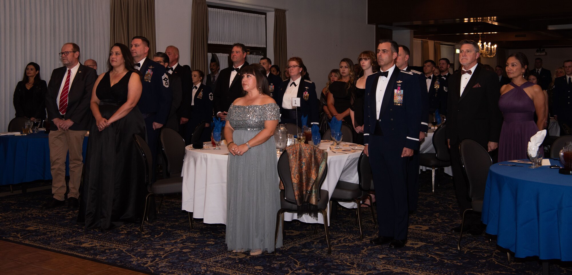 Members stand at attention