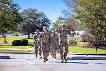 Soldiers walk back to the barracks after restocking on a shopping trip. The local municipalities, community partners, and Army came together to support each other and the surrounding communities in the wake of Hurricane Helene. Fort Eisenhower sustained significant damage, loss of power, and loss of water service