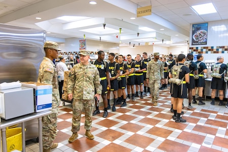 Fort Eisenhower Command Sergeant Major Dan Durrett greets and talks to Soldiers at the Dining Facility. Fort Eisenhower’s Dining Facility #1 opened to survive a hot breakfast to Soldiers on Fort Eisenhower. The local municipalities, community partners, and Army came together to support each other and the surrounding communities in the wake of Hurricane Helene. Fort Eisenhower sustained significant damage, loss of power, and loss of water service. (U.S. Army Photo by David Logsdon, Fort Eisenhower Public Affairs)