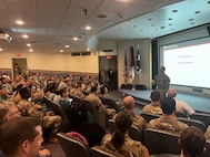 Dwight D. Eisenhower Army Medical Center personnel gather after Hurricane Helene devasted Fort Eisenhower and the surrounding areas to discuss emergency operations after losing shore power and water services.