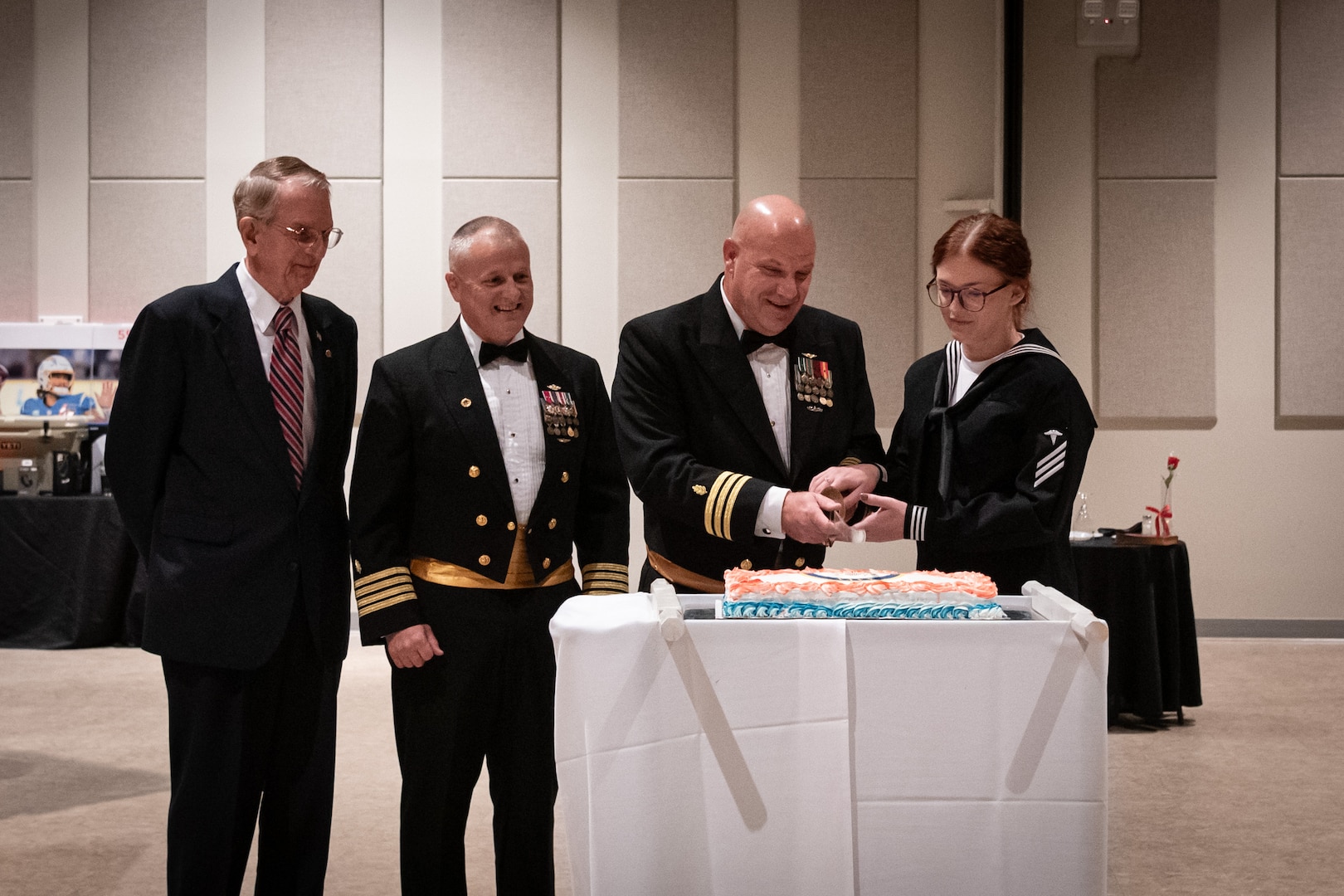 From right to left, Hospitalman Kate Helmke, Commander Carlton Bennett, Navy Captain Sean Barbabella and Mr. Wilbur D. Jones Jr. conduct the cake cutting ceremony at the Navy Ball hosted by Naval Health Clinic Cherry Point on Friday, October 4, 2024 at the Havelock Convention Center, Havelock North Carolina.  Sailors, Marines and civilians serving aboard Marine Corps Air Station Cherry Point gathered for the formal to celebrate the 249th birthday of the U.S. Navy.