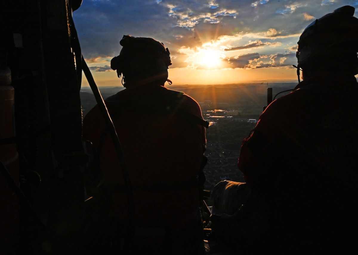 U.S. Airmen assigned to the 48th Rescue Squadron, forward deployed as the 563rd Personnel Recovery Task Force, fly in a HH-60W Jolly Green II helicopter at various locations in Tennessee, Oct. 2, 2024, in support of the U.S. Northern Command and Air Forces Northern, Defense Support of Civil Authorities Disaster Relief mission. The Airmen conducted site surveys and conducted mission rehearsals in preparation for rescue and recovery operations of civilians impacted by Hurricane Helene. (U.S. Air Force photo by Staff Sgt. Abbey Rieves)