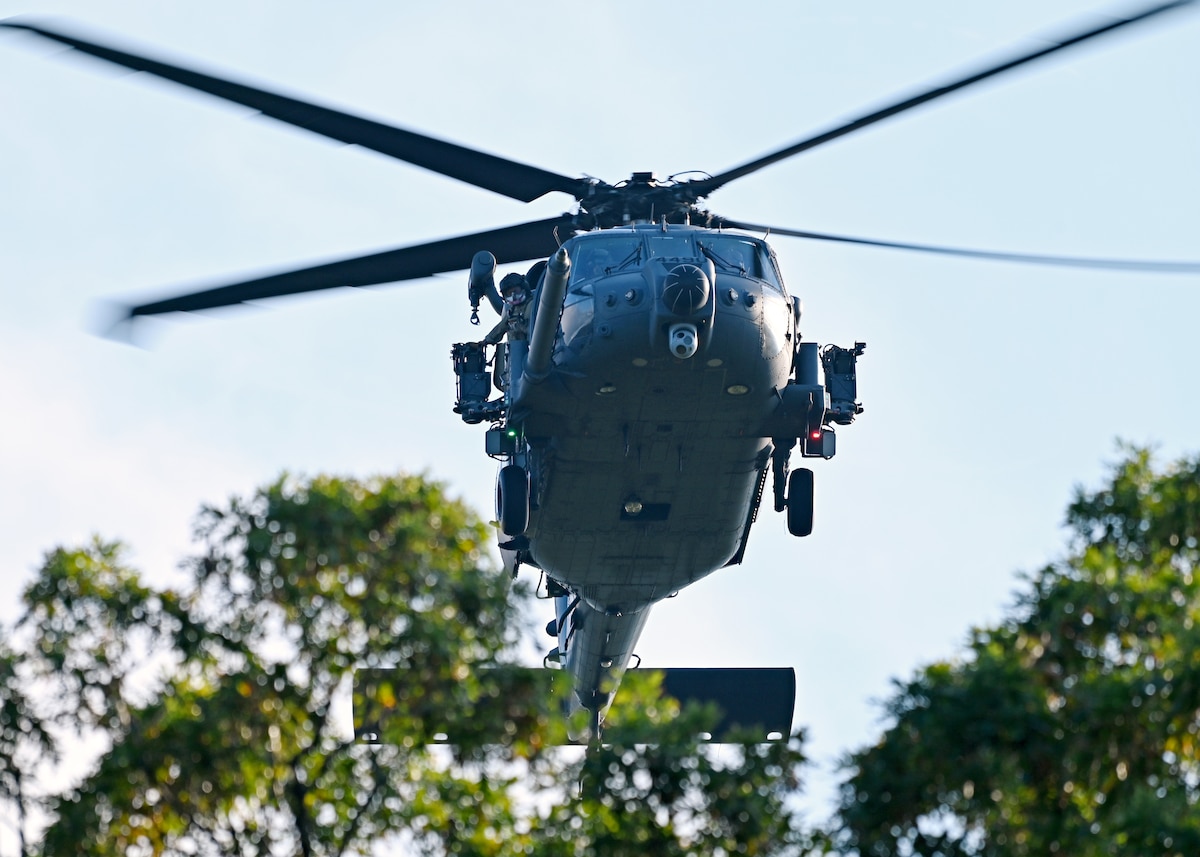 An HH-60W Jolly Green II helicopter assigned to the 55th Rescue Squadron, forward deployed as the 563rd Personnel Recovery Task Force, conducts mission rehearsals at various locations around Tennessee, Oct. 2, 2024, in support of the U.S. Northern Command and Air Forces Northern, Defense Support of Civil Authorities Disaster Relief mission. The Department of Defense has unique capabilities, including an ability to deploy on short notice into austere environments, while providing resources that are not readily available in other federal agencies or the private sector. (U.S. Air Force photo by Staff Sgt. Abbey Rieves)