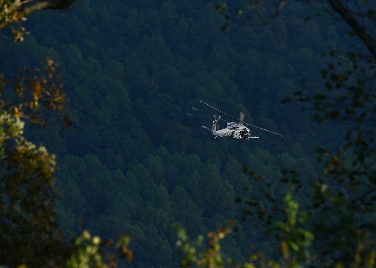 An HH-60W Jolly Green II helicopter assigned to the 55th Rescue Squadron, forward deployed as the 563rd Personnel Recovery Task Force, conducts mission rehearsals in Tennessee, Oct. 2, 2024, in support of the U.S. Northern Command and Air Forces Northern, Defense Support of Civil Authorities Disaster Relief mission. USNORTHCOM works year-round with federal, state, local, tribal, and territorial partners to ensure plans, communications, and interagency relationships are always ready to support our lead federal agencies to deliver the right military-unique capabilities at the right time and place. (U.S. Air Force photo by Staff Sgt. Abbey Rieves)