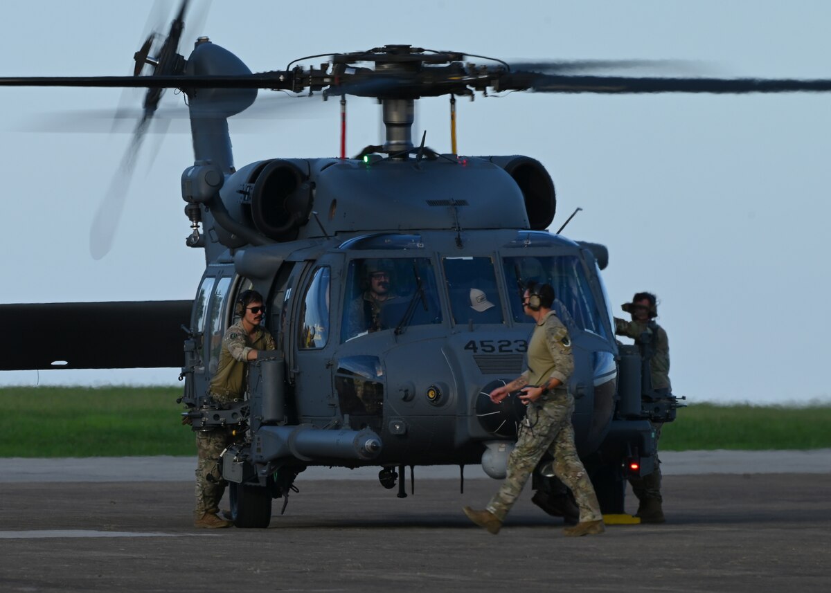 U.S. Airmen assigned to the 55th Rescue Generation Squadron, forward deployed as the 563rd Personnel Recovery Task Force, conduct preflight checks at McGhee Tyson Air National Guard Base, Tennessee, Oct. 3, 2024, in support of the U.S. Northern Command and Air Forces Northern, Defense Support of Civil Authorities Disaster Relief mission. Davis-Monthan Air Force Base’s rescue assets were tasked with rescue and recovery operations for residents impacted by Hurricane Helene. (U.S. Air Force photo by Staff Sgt. Abbey Rieves)