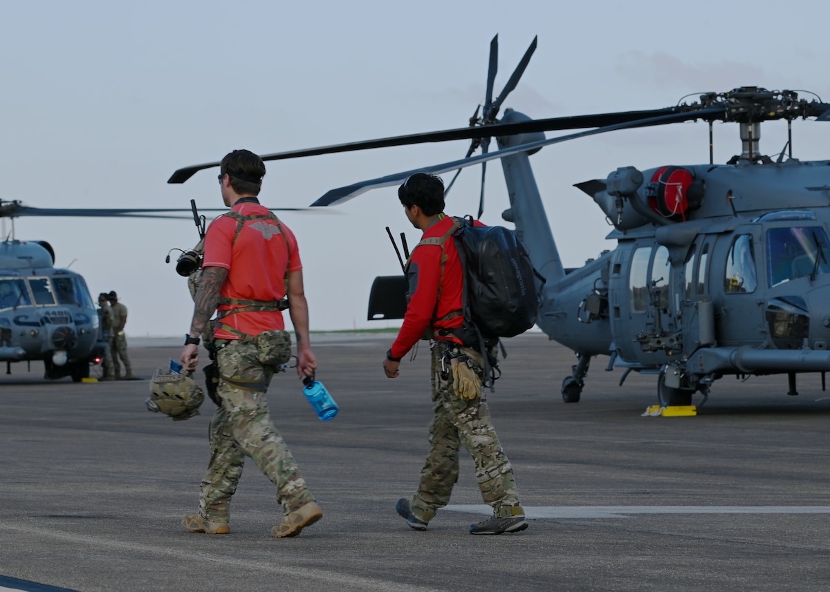 U.S. Air Force pararescuemen assigned to the 48th Rescue Squadron, forward deployed as the 563rd Personnel Recovery Task Force, prepare for their first Hurricane Helene rescue tasking at McGhee Tyson Air National Guard Base, Tennessee, Oct. 3, 2024, in support of the U.S. Northern Command and Air Forces Northern, Defense Support of Civil Authorities Disaster Relief mission. Rescue assets launched two HH-60W Jolly Green II helicopters to conduct search and rescue operations for residents impacted by Hurricane Helene. (U.S. Air Force photo by Staff Sgt. Abbey Rieves)