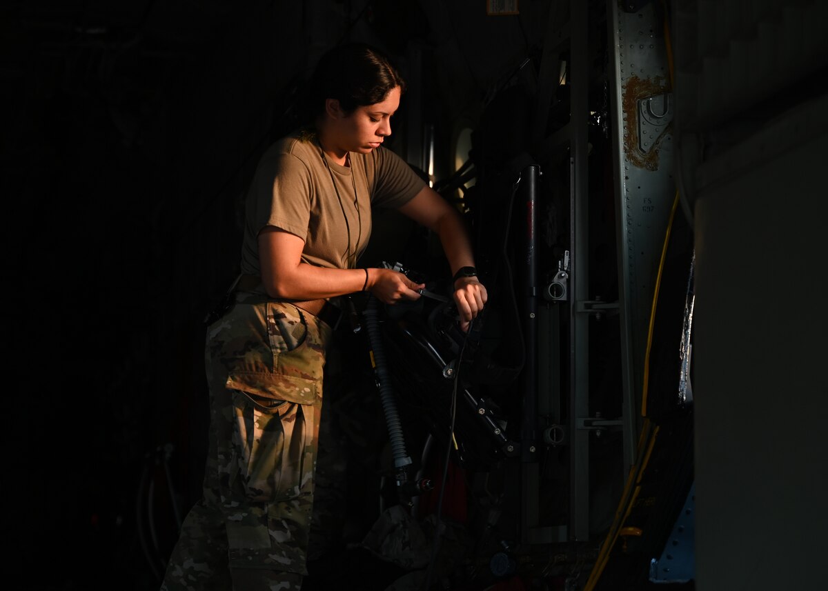 U.S. Air Force Airman 1st Class Jocelyn Lopez, 79th Rescue Squadron loadmaster, forward deployed in the 563rd Personnel Recovery Task Force, preforms preflight servicing at McGhee Tyson Air National Guard Base, Tennessee, Oct. 3, 2024, in support of the U.S. Northern Command and Air Forces Northern, Defense Support of Civil Authorities Disaster Relief mission. The Department of Defense's collaborative, whole-of-government response efforts with interagency partners demonstrate the national capabilities and resilience. (U.S. Air Force photo by Staff Sgt. Abbey Rieves)