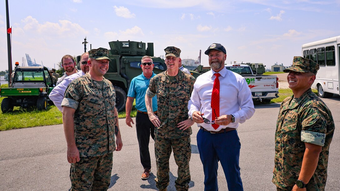 U.S. Marine Corps Master Gunnery Sgt. Garrett Mitchell, operations chief, Blount Island Command, and Col. Luke Watson, commanding officer, Blount Island Command, showcase Exercise Coastal Response to Rep. Aaron Bean, R-Fla., during the congressman's visit Aug. 8, 2024, to Marine Corps Support Facility Blount Island in Florida.