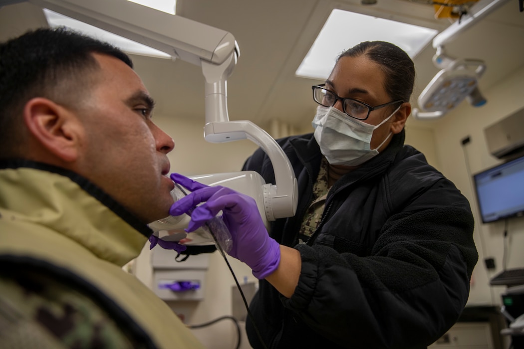 240930-N-CO542-1058 Hospital Corpsman 3rd Class Kimberly Lopez, from Chicago, performs a dental X-Ray aboard amphibious assault carrier USS Tripoli (LHA 7), September 30, 2024. Tripoli is an America-class amphibious assault ship homeported in San Diego. (U.S. Navy photo by Mass Communication Specialist Seaman Apprentice Eliora Sims)