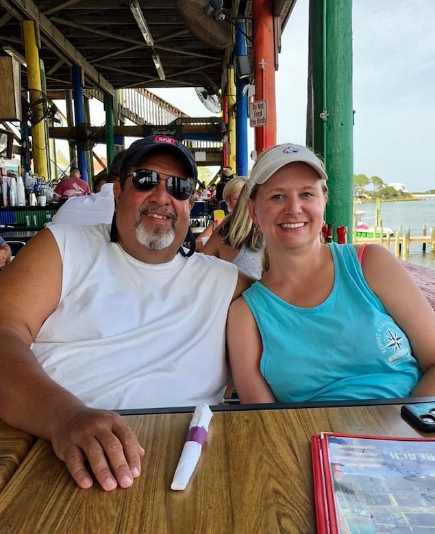 Man and woman sitting at a table.