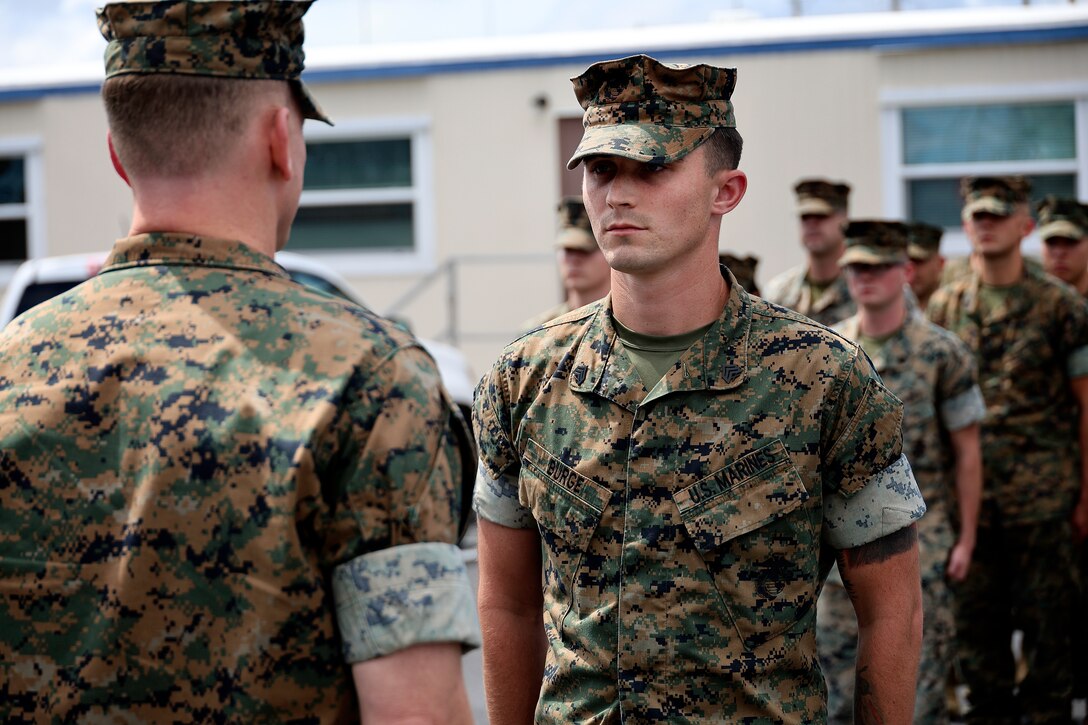 U.S. Marine Corps Col. Luke Watson, commanding officer, Blount Island Command, prepares to award a certification of commendation to Sgt. Dylan Burge of Lawrenceville, Ga., during a formation Aug. 26, 2024, at Marine Corps Support Facility Blount Island in Florida. Burge earned noncommissioned officer of the quarter for Marine Corps Logistics Command (LOGCOM), headquartered in Albany, Ga. “Throughout the quarter, Sgt. Burge continually set the example for his peers by demonstrating outstanding leadership, extraordinary commitment to mission accomplishment and exceptional strength of character,” said Maj. Gen. Keith Reventlow, commanding general, LOGCOM, in the commendation certificate. Burge reported to boot camp in June 2018, soon after graduating from high school. He currently serves as Blount Island Command individual material readiness list manager, as well as career planner. “You’re a Marine on and off the clock, so use every moment to make yourself better,” said Burge, facing the company of Marines in Florida. He said earning the distinction doesn’t change anything, adding, “what’s most important is being able to work with these guys every day.”