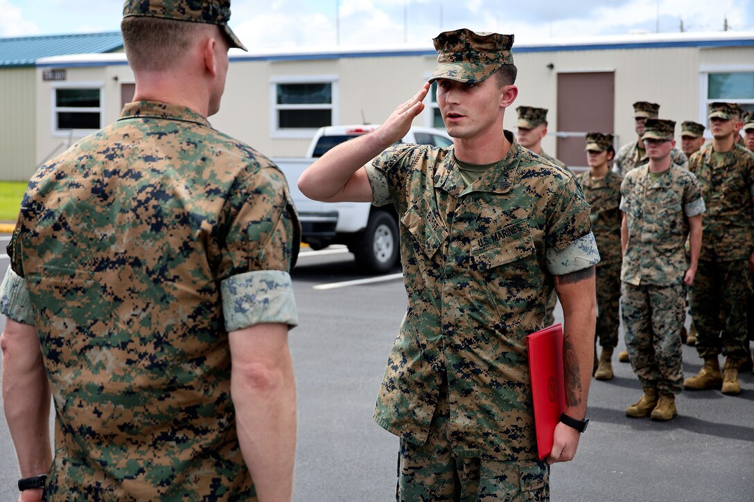 U.S. Marine Corps Col. Luke Watson, commanding officer, Blount Island Command, awards a certification of commendation to Sgt. Dylan Burge of Lawrenceville, Ga., during a formation Aug. 26, 2024, at Marine Corps Support Facility Blount Island in Florida. Burge earned noncommissioned officer of the quarter for Marine Corps Logistics Command (LOGCOM), headquartered in Albany, Ga. “Throughout the quarter, Sgt. Burge continually set the example for his peers by demonstrating outstanding leadership, extraordinary commitment to mission accomplishment and exceptional strength of character,” said Maj. Gen. Keith Reventlow, commanding general, LOGCOM, in the commendation certificate. Burge reported to boot camp in June 2018, soon after graduating from high school. He currently serves as Blount Island Command individual material readiness list manager, as well as career planner. “You’re a Marine on and off the clock, so use every moment to make yourself better,” said Burge, facing the company of Marines in Florida. He said earning the distinction doesn’t change anything, adding, “what’s most important is being able to work with these guys every day.”