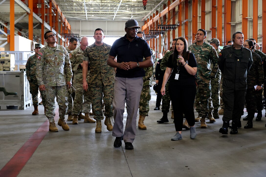 Thurman Bobbett, head of maintenance management branch, Blount Island Command, explains corrective and preventative maintenance procedures for students from Western Hemisphere Institute for Security Cooperation during a tour Sept. 13, 2024, at Marine Corps Support Facility Blount Island in Florida. Of the nearly 60 students from the military education and training institute in Fort Moore, Georgia, roughly half were staff officers from a dozen partner nations spanning from Mexico through South America. After learning about military equipment and staging areas, the students toured USNS 1st Lt. Baldomero Lopez, a U.S. Navy roll-on, roll-off support cargo ship operated by Military Sealift Command. The 1,100-acre Marine Corps facility, located along the St. Johns River in northeast Florida, is the hub of Marine Corps’ prepositioning programs. Blount Island Command personnel—service members, government civilians and federal contractors—ensure Marines responding to global contingency areas are supported with the highest quality combat-ready equipment and supplies.
