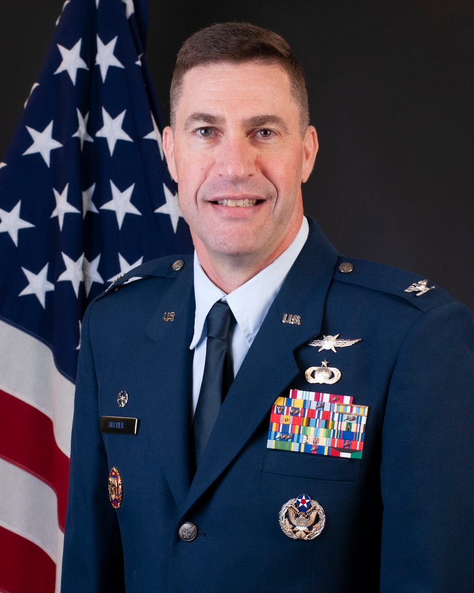 Official Photo of Col. Kevin Archer, a male colonel in an Air Force uniform