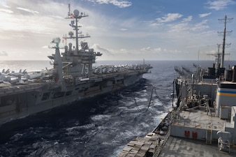 USS Harry S. Truman (CVN 75) replenishes from USNS Arctic (T-AOE 8) in the Atlantic Ocean.