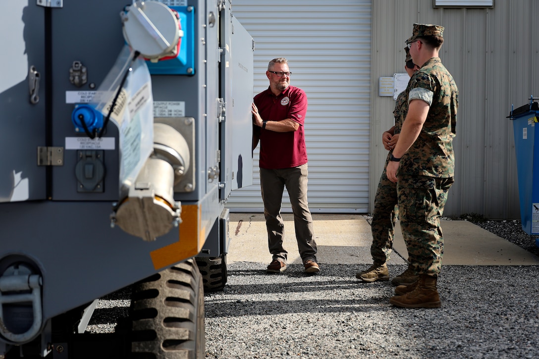 Bill Pawlowski, Lockheed Martin senior field engineer, explains polyalphaolefin fluid servicing carts, which cool F-35 aircraft mission systems, Sept. 24, 2024, at Marine Corps Support Facility Blount Island in Florida. The facility, located along the St. Johns River in northeast Florida, is the hub of Marine Corps’ prepositioning programs. With the transition to the F-35 offering advanced stealth and sensor capabilities in a long-range fighter platform, the aircraft’s ground support equipment is now a maritime prepositioning force asset—it must be strategically positioned with other combat-ready equipment and supplies. Technical subject-matter experts arrived at the facility in Florida for the induction. While contractors maintain the equipment, Marines must conduct in-process inspections, ensuring adherence to approved ground operations procedures. “We make sure everything we put into the ships is a quality product,” said Marine Corps Sgt. Mason Musmeci of Mandeville, Louisiana, ground support equipment quality assurance representative at Blount Island Command.