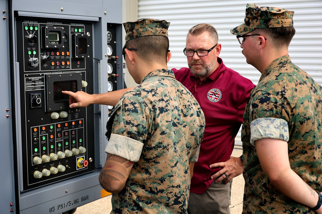 Bill Pawlowski, Lockheed Martin senior field engineer, explains polyalphaolefin fluid servicing carts, which cool F-35 aircraft mission systems, Sept. 24, 2024, at Marine Corps Support Facility Blount Island in Florida. The facility, located along the St. Johns River in northeast Florida, is the hub of Marine Corps’ prepositioning programs. With the transition to the F-35 offering advanced stealth and sensor capabilities in a long-range fighter platform, the aircraft’s ground support equipment is now a maritime prepositioning force asset—it must be strategically positioned with other combat-ready equipment and supplies. Technical subject-matter experts arrived at the facility in Florida for the induction. While contractors maintain the equipment, Marines must conduct in-process inspections, ensuring adherence to approved ground operations procedures. “We make sure everything we put into the ships is a quality product,” said Marine Corps Sgt. Mason Musmeci of Mandeville, Louisiana, ground support equipment quality assurance representative at Blount Island Command.