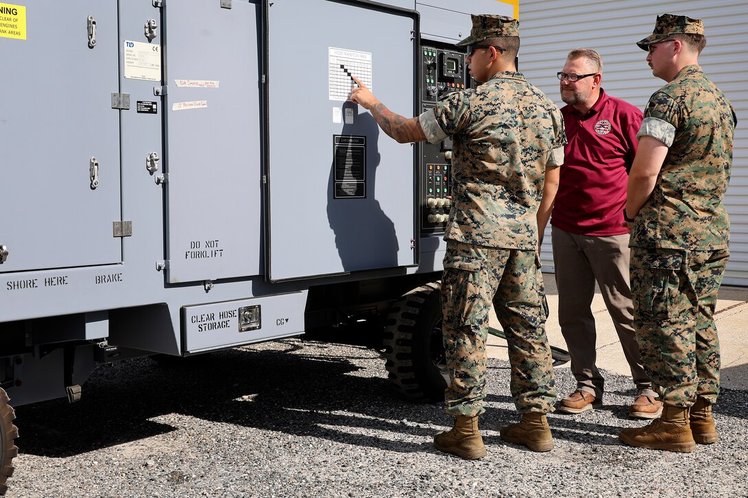 Marine Corps Sgt. Joseph Sortman of Long Beach, California, is trained on polyalphaolefin fluid servicing carts, which cool F-35 aircraft mission systems, by Bill Pawlowski, Lockheed Martin senior field engineer, Sept. 24, 2024, at Marine Corps Support Facility Blount Island in Florida. The facility, located along the St. Johns River in northeast Florida, is the hub of Marine Corps’ prepositioning programs. With the transition to the F-35 offering advanced stealth and sensor capabilities in a long-range fighter platform, the aircraft’s ground support equipment is now a maritime prepositioning force asset—it must be strategically positioned with other combat-ready equipment and supplies. Technical subject-matter experts arrived at the facility in Florida for the induction. While contractors maintain the equipment, Marines must conduct in-process inspections, ensuring adherence to approved ground operations procedures. “We make sure everything is maintained correctly and safely,” said Sortman, ground support equipment quality assurance representative at Blount Island Command.