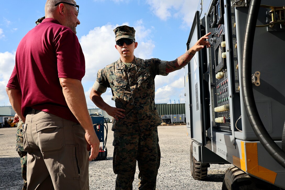 Bill Pawlowski, Lockheed Martin senior field engineer, trains Marine Corps Sgt. Joseph Sortman of Long Beach, California, on polyalphaolefin fluid servicing carts, which cool F-35 aircraft mission systems, Sept. 24, 2024, at Marine Corps Support Facility Blount Island in Florida. The facility, located along the St. Johns River in northeast Florida, is the hub of Marine Corps’ prepositioning programs. With the transition to the F-35 offering advanced stealth and sensor capabilities in a long-range fighter platform, the aircraft’s ground support equipment is now a maritime prepositioning force asset—it must be strategically positioned with other combat-ready equipment and supplies. Technical subject-matter experts arrived at the facility in Florida for the induction. While contractors maintain the equipment, Marines must conduct in-process inspections, ensuring adherence to approved ground operations procedures. “We make sure everything is maintained correctly and safely,” said Sortman, ground support equipment quality assurance representative at Blount Island Command.