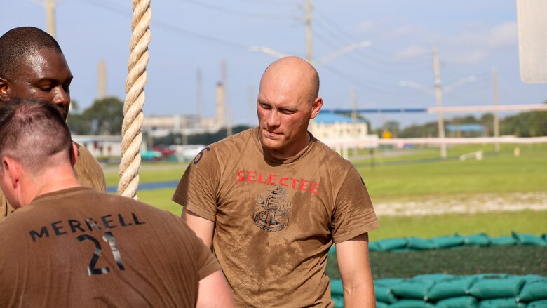 Petty Officer First Class Bob Hobronhyland of Staten Island, New York, assigned to the U.S. Navy destroyer USS Carney, homeported at Naval Station Mayport in Jacksonville, traverses an obstacle course while completing chief petty officer initiation capstone events Sept. 25 at Marine Corps Support Facility Blount Island in Florida.