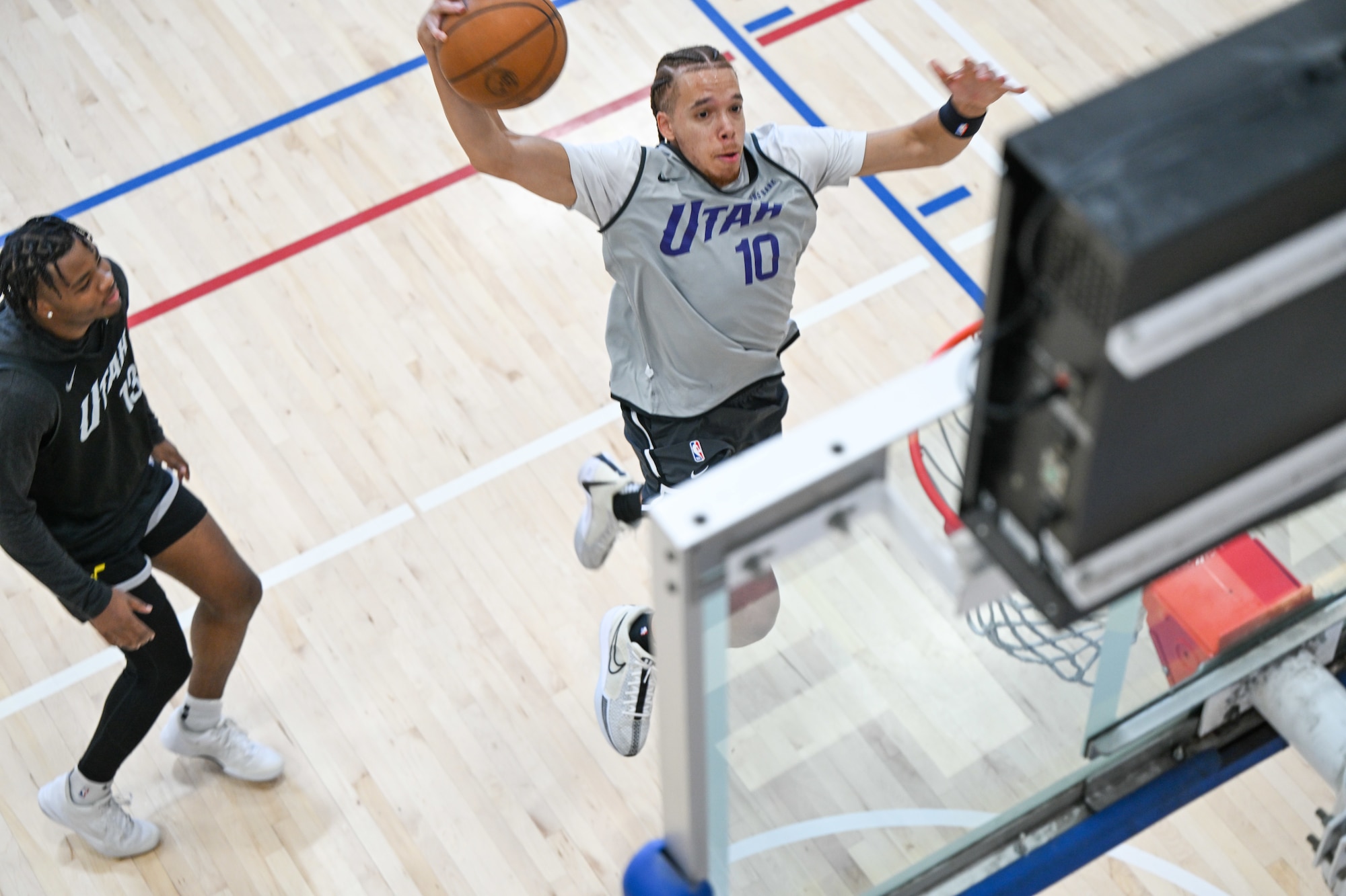 Preston jumps to dunk a ball.