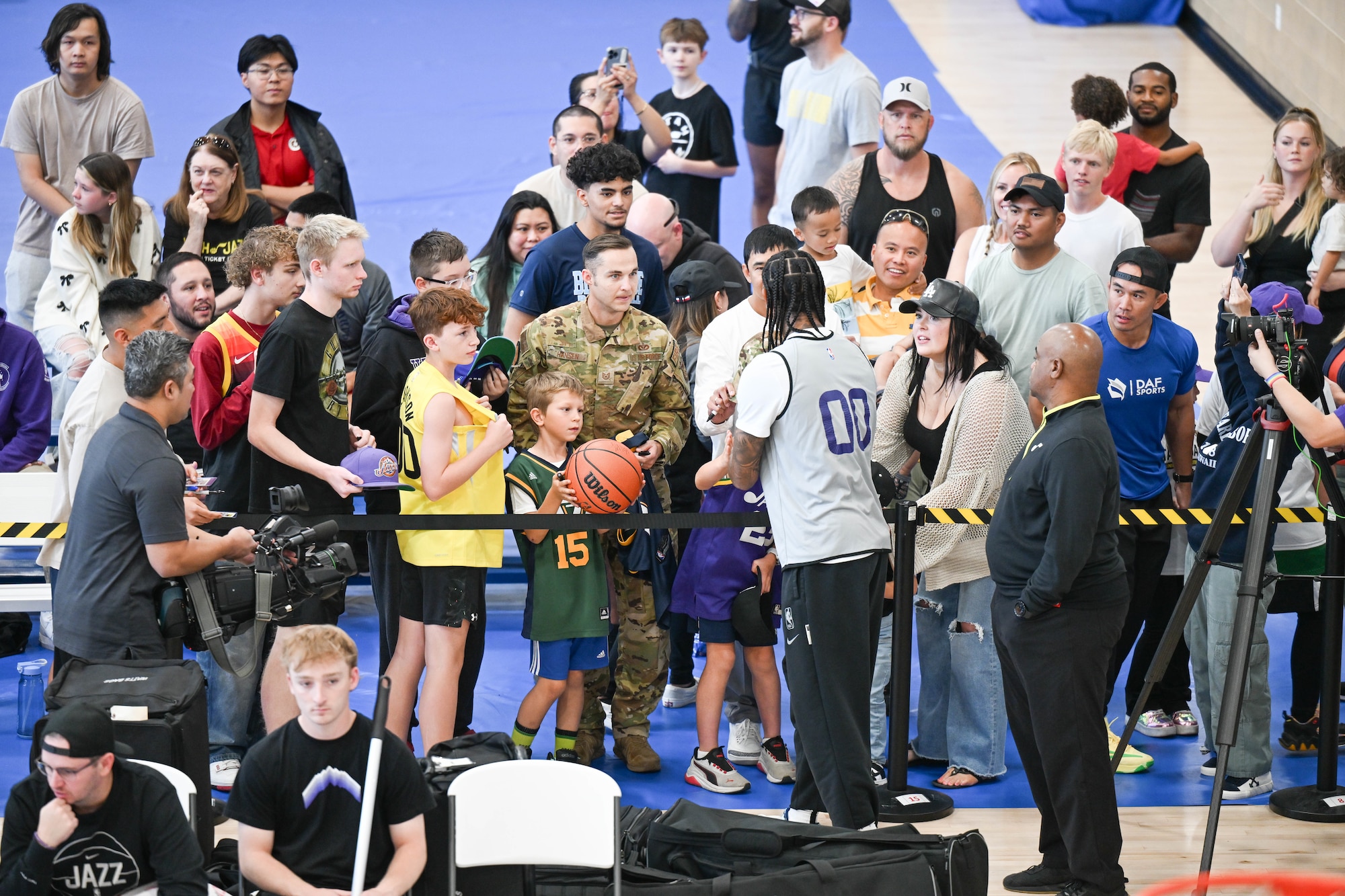 Clarkson signs autographs for military families.
