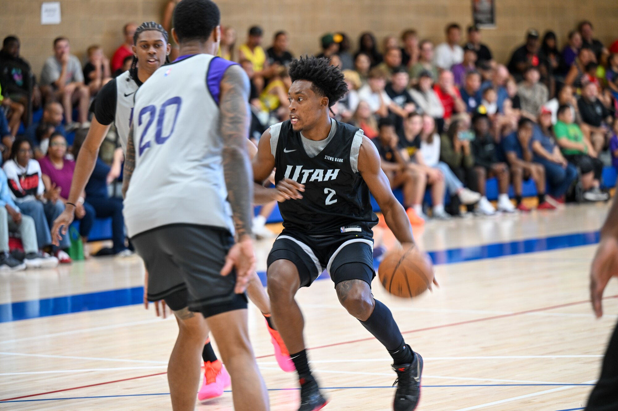 Sexton dribbles the ball around other players.