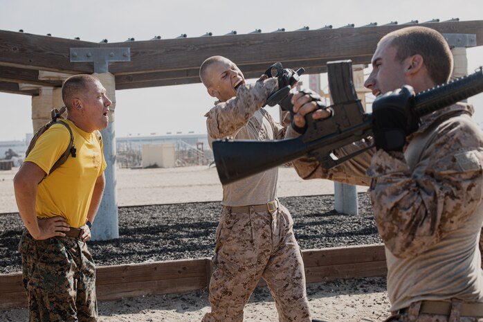 U.S. Marine Corps Sgt. Jonothan Harbert, left, a drill instructor with Golf Company, 2nd Recruit Training Battalion, gives instructions to recruits during the confidence course training event at Marine Corps Recruit Depot San Diego, California, Sept. 23, 2024. The confidence course challenges recruits physically and mentally through obstacles that require confidence in their strength, balance, and determination. (U.S. Marine Corps photo by Cpl. Sarah M. Grawcock)