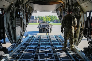 Members of the 76th Aerial Port Squadron prepare to load an airdrop training pallet into a C-130H Hercules aircraft stationed at Youngstown Air Reserve Station, Ohio, Oct. 6, 2024