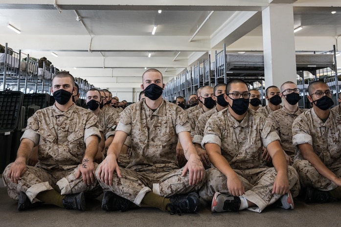 U.S. Marine Corps recruits with Charlie Company, 1st Recruit Training Battalion, wait to meet their drill instructors as part of a pick-up event at Marine Corps Recruit Depot San Diego, California, Sept. 20, 2024. Pick-up day signifies the first official day of training in which recruits will meet their drill instructor team for the first time, prepare their gear and squad bay, and expectations are set for the remainder of their time in recruit training. (U.S. Marine Corps photo by Cpl. Sarah M. Grawcock)
