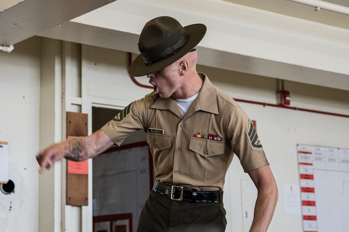 U.S. Marine Corps Staff Sgt. Christophe Blossom, a senior drill instructor with Charlie Company, 1st Recruit Training Battalion, conducts an initial drill instructor speech to the new recruits at Marine Corps Recruit Depot San Diego, California, Sept. 20, 2024. Pick-up day signifies the first official day of training in which recruits will meet their drill instructor team for the first time, prepare their gear and squad bay, and expectations are set for the remainder of their time in recruit training. (U.S. Marine Corps photo by Cpl. Sarah M. Grawcock)