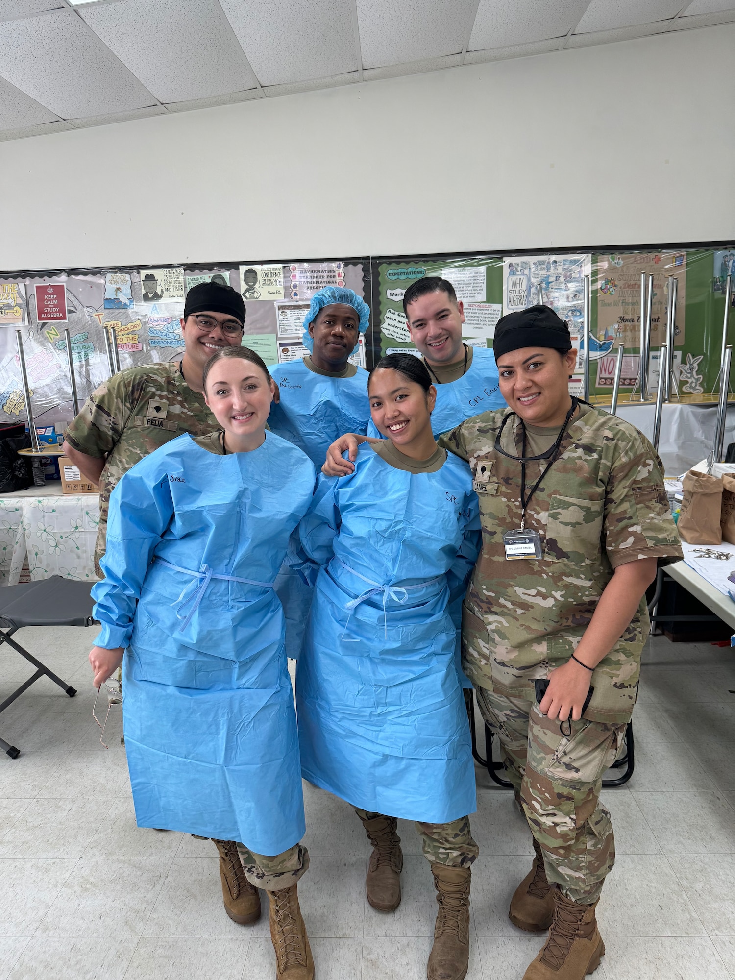 Tech Sgt. Charity Sisco, 168th Wing dental assistant, front left, poses for a photo with her Innovative Readiness Training dental team during the IRT in Saipan.