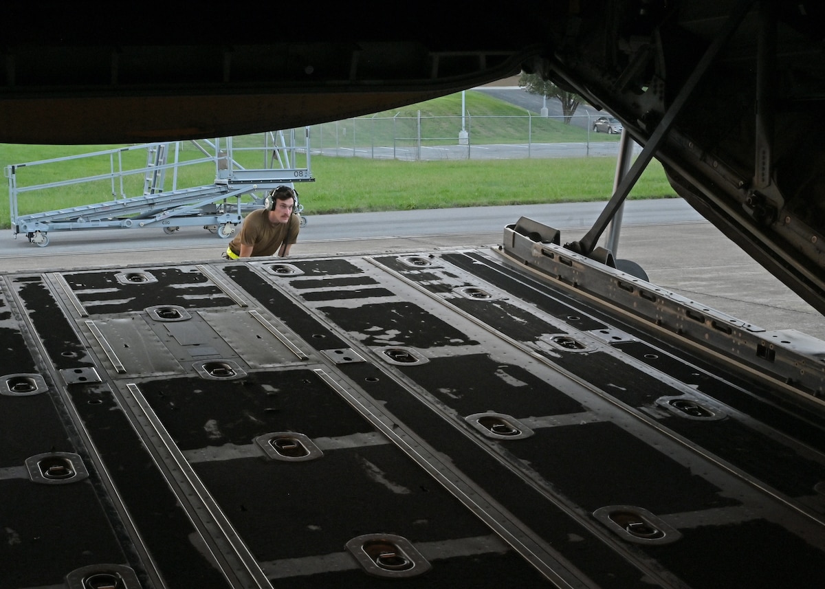 A U.S. Airman assigned to the 79th Rescue Generation Squadron, forward deployed in the 563rd Personnel Recovery Task Force, prepares an HC-130J Combat King II aircraft for flight at McGhee Tyson Air National Guard Base, Tennessee, Oct. 3, 2024, in support of the U.S. Northern Command and Air Forces Northern, Defense Support of Civil Authorities Disaster Relief mission. Rescue assets from Davis-Monthan Air Force Base, Arizona are tasked to conduct rescue and recovery operations for civilians impacted by Hurricane Helene. (U.S. Air Force photo by Staff Sgt. Abbey Rieves)