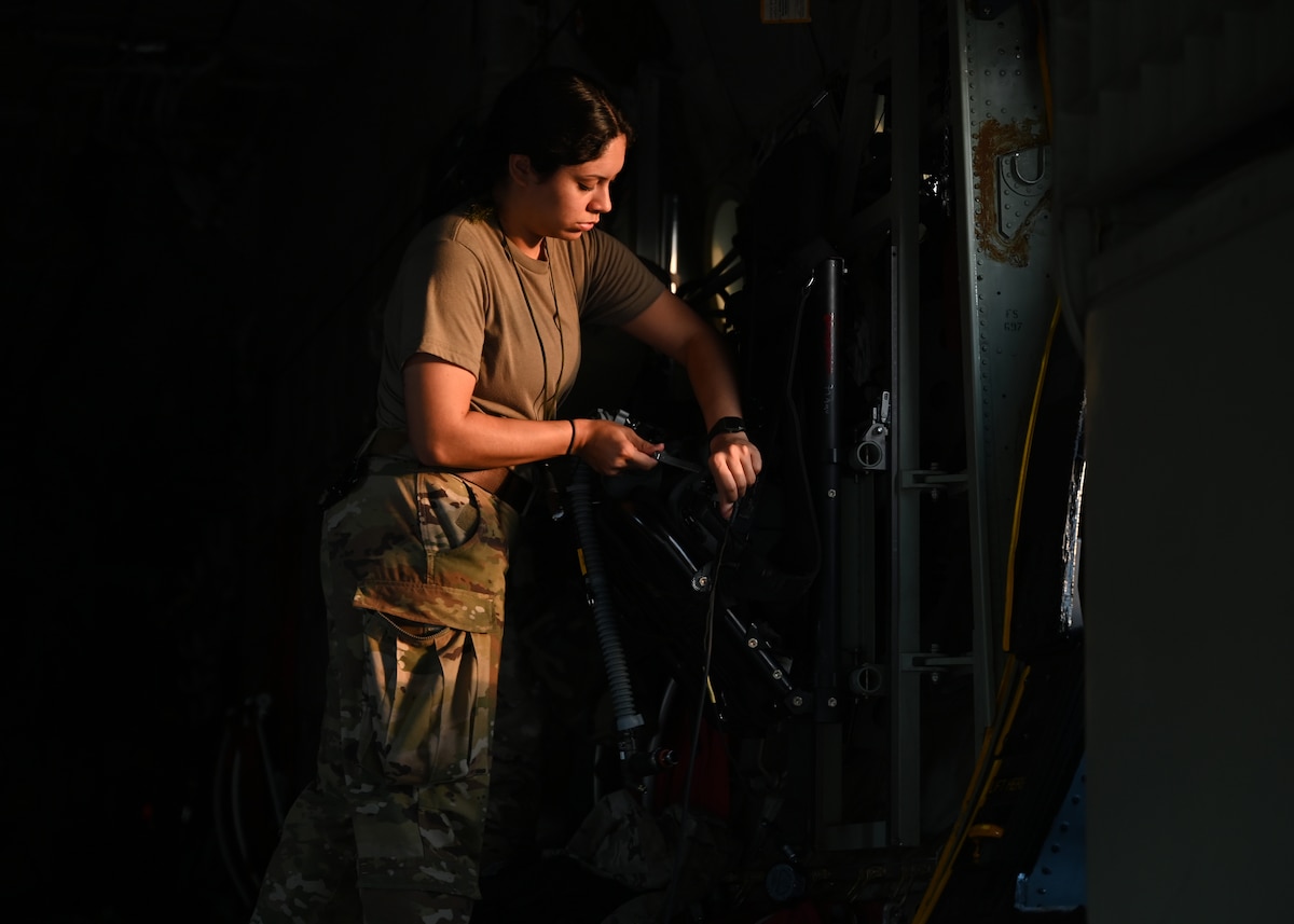 U.S. Air Force Airman 1st Class Jocelyn Lopez, 79th Rescue Squadron loadmaster, forward deployed in the 563rd Personnel Recovery Task Force, preforms preflight servicing at McGhee Tyson Air National Guard Base, Tennessee, Oct. 3, 2024, in support of the U.S. Northern Command and Air Forces Northern, Defense Support of Civil Authorities Disaster Relief mission. The Department of Defense's collaborative, whole-of-government response efforts with interagency partners demonstrate the national capabilities and resilience. (U.S. Air Force photo by Staff Sgt. Abbey Rieves)
