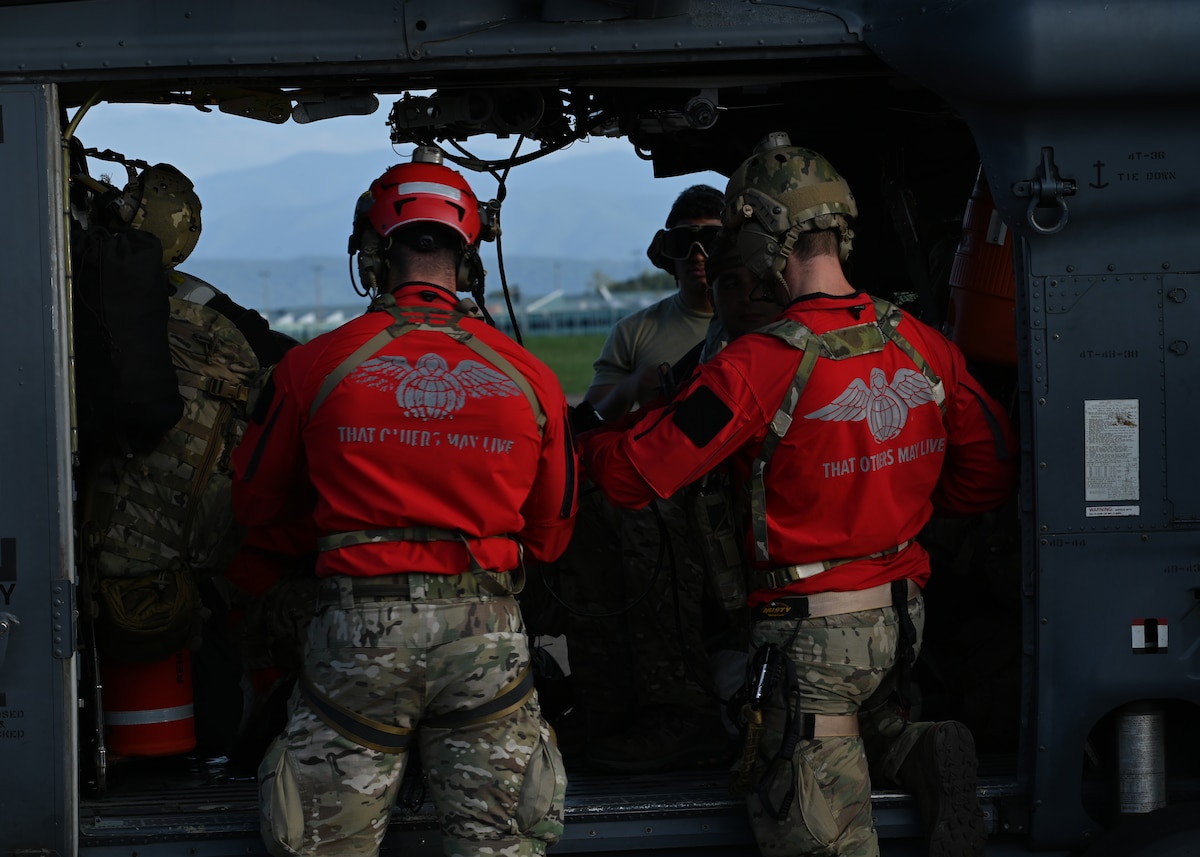 U.S. Air Force pararescuemen assigned to the 48th Rescue Squadron, forward deployed as the 563rd Personnel Recovery Task Force, pack supplies at McGhee Tyson Air National Guard Base, Tennessee, Oct. 3, 2024, in support of the U.S. Northern Command and Air Forces Northern, Defense Support of Civil Authorities Disaster Relief mission. The task force employs by any means available to provide combat and humanitarian search, rescue and medical assistance in all environments, such as Hurricane Helene. (U.S. Air Force photo by Staff Sgt. Abbey Rieves)