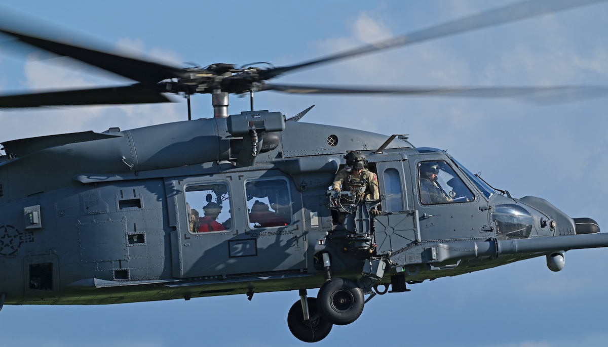 U.S. Air Force Tech. Sgt. Kendras Reyes, 55th Rescue Squadron special missions aviator, forward deployed in the 563rd Personnel Recovery Task Force, watches flying operations at various locations in Tennessee, Oct. 2, 2024, in support of the U.S. Northern Command and Air Forces Northern, Defense Support of Civil Authorities Disaster Relief mission. More than 100 personnel forward deployed from Davis-Monthan Air Force Base, Arizona within 12 hours to support rescue and recovery operations of civilians impacted by Hurricane Helene. (U.S. Air Force photo by Staff Sgt. Abbey Rieves)