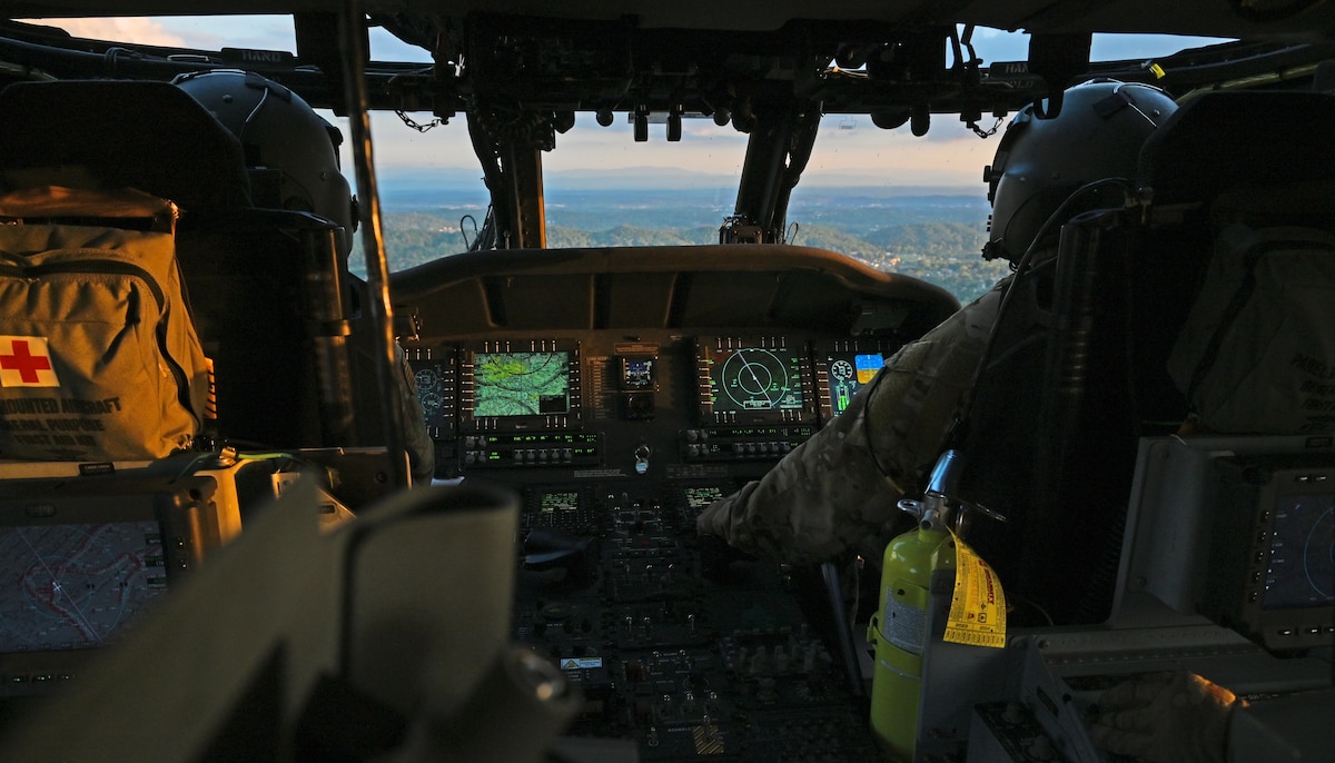 U.S. Airmen assigned to the 55th Rescue Squadron, forward deployed as the 563rd Personnel Recovery Task Force, fly an HH-60W Jolly Green II helicopter at various locations in Tennessee, Oct. 2, 2024, in support of the U.S. Northern Command and Air Forces Northern, Defense Support of Civil Authorities Disaster Relief mission. Rescue assets from Davis-Monthan Air Force Base, Arizona practiced rescue and recovery operations to serve residents impacted by Hurricane Helene. (U.S. Air Force photo by Staff Sgt. Abbey Rieves)