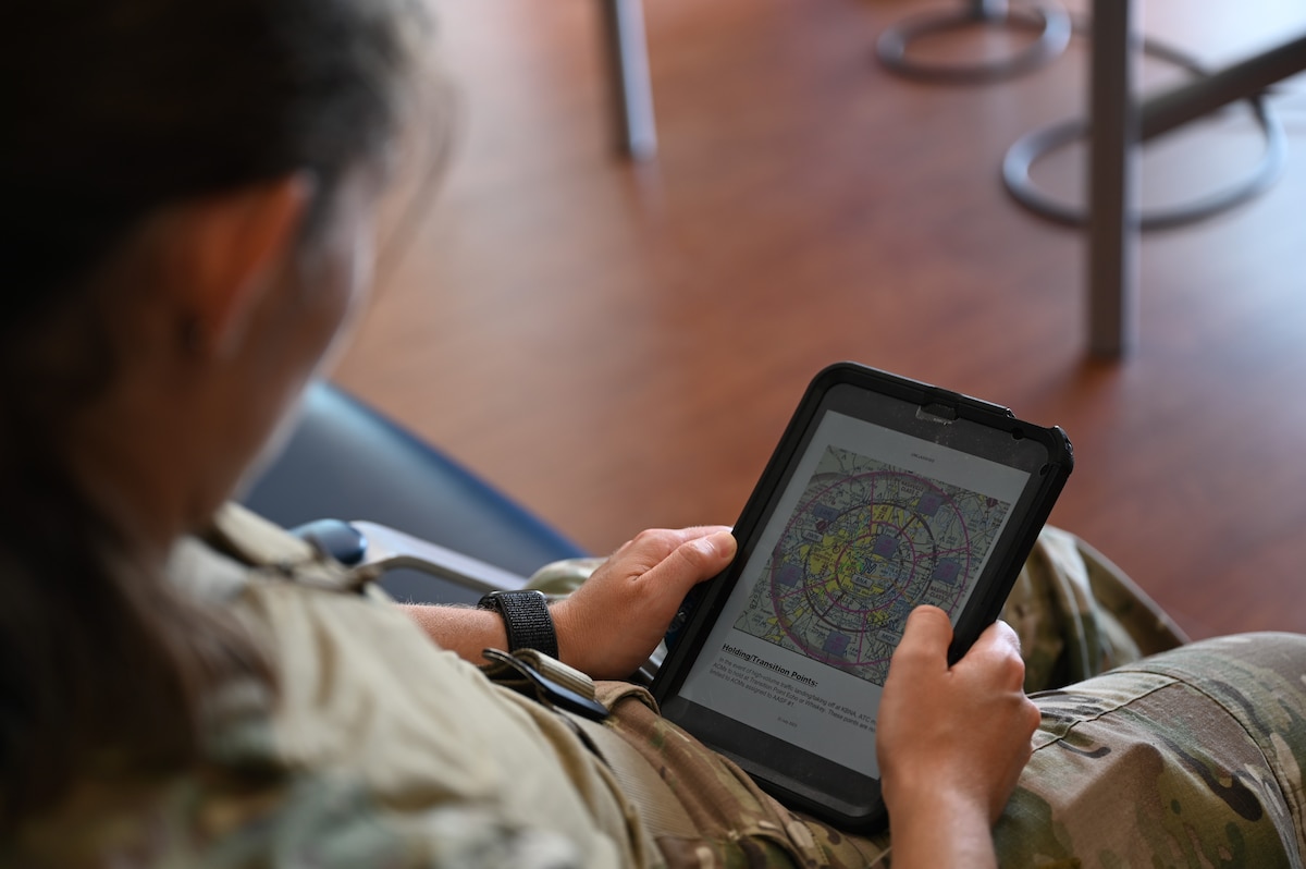 A U.S. Airman assigned to the 55th Rescue Squadron, forward deployed as the 563rd Personnel Recovery Task Force, reviews flight patterns at McGhee Tyson Air National Guard Base, Tennessee, Oct. 2, 2024, in support of the U.S. Northern Command and Air Forces Northern, Defense Support of Civil Authorities Disaster Relief mission. Airmen from Davis-Monthan Air Force Base, Arizona, prepared for airborne and ground search and rescue efforts for civilians impacted by Hurricane Helene. (U.S. Air Force photo by Senior Airman Andrew Garavito)
