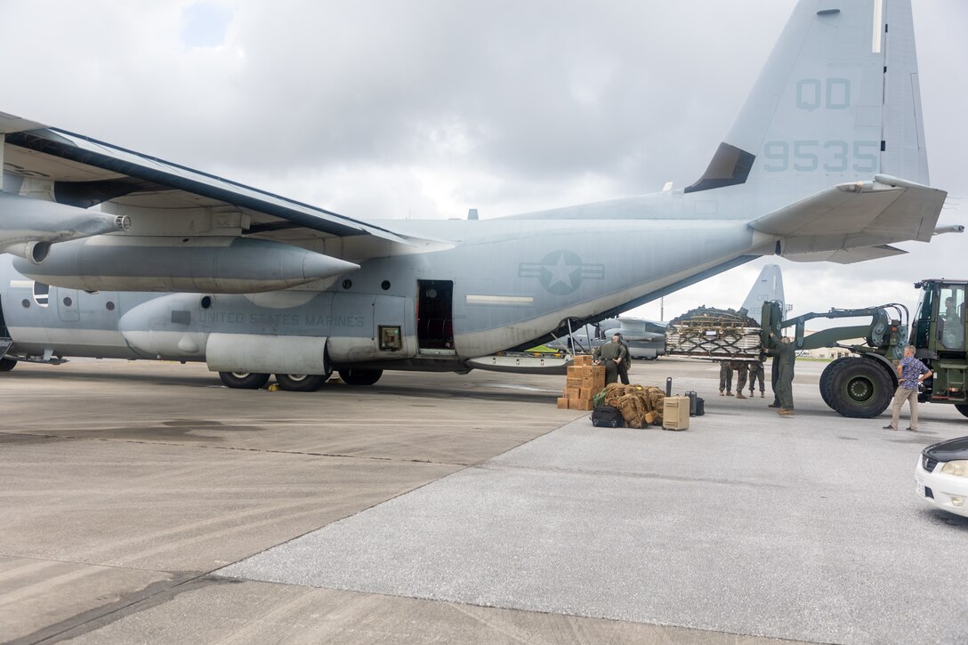 U.S. Marines with III Marine Expeditionary Force load cargo onto a KC-130J Super Hercules aircraft with Marine Aerial Refueler Transport Squadron 152, Marine Aircraft Group 12, 1st Marine Aircraft Wing at Kadena Air Base, Okinawa, Japan, Oct. 5, 2024. The U.S. Department of Defense is supporting the Republic of the Philippines at the request of the Government of the Philippines during humanitarian assistance and disaster relief operations in the aftermath of Typhoon Krathon (Julian) in Northern Luzon. (U.S. Marine Corps photo by Sgt. Gabriel Antwiler)