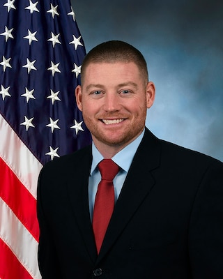 Portrait of man with USA Flag in background