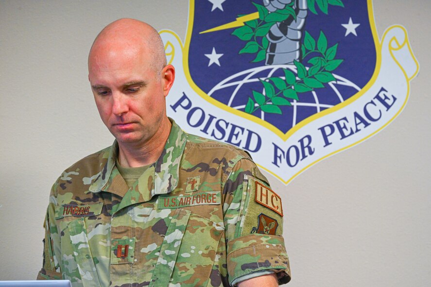 U.S. Air Force Capt. Brian Harris, 5th Bomb Wing chaplain, prepares for a combined mission brief at Minot Air Force Base, North Dakota, Oct. 2, 2024. Local religious leaders visited the base for the 5 BW Chaplain Corps Clergy Day tour.