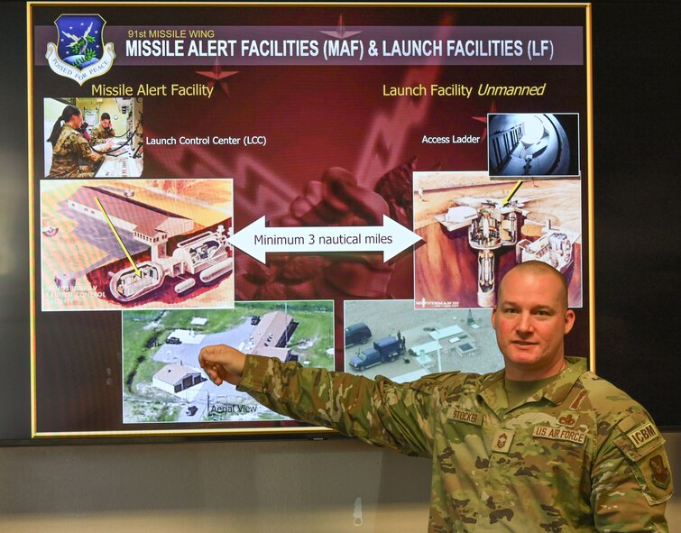 Chief Master Sgt. Ryan Stocker, 91st Maintenance Group senior enlisted leader, presents during the 5th Bomb Wing Chaplain Corps Clergy Day tour at Minot Air Force Base, North Dakota, Oct. 2, 2024. Stocker spoke about the importance of the 91st Missile Wing mission on and off base.