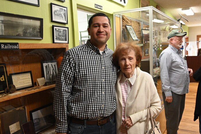 A man in a button-up shirt poses with a woman in a cardigan at McNary's 70th anniversary.