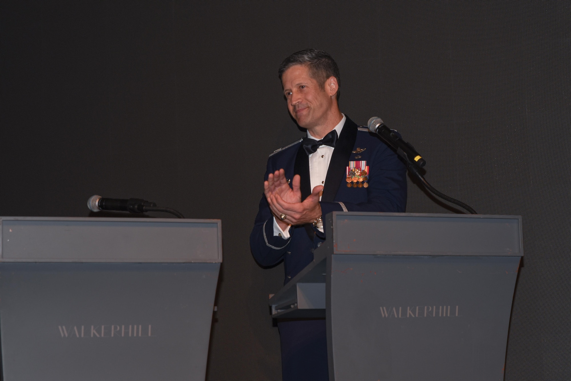 U.S. Air Force Col. William McKibban, 51st Fighter Wing commander, claps while giving opening remarks during 7th Air Force’s Peninsula Wide AF Ball at the Grand Walkerhill Hotel in Seoul, Republic of Korea, Oct. 4, 2024. The ball was hosted by the 51st Fighter Wing but was open to all AF personnel on the ROK peninsula. (U.S. Air Force photo by Staff Sgt. Kahdija Slaughter)