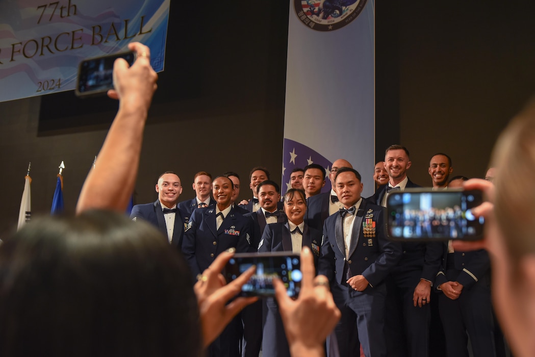 7th Air Force’s Peninsula Wide AF Ball attendees pose for photos at the Grand Walkerhill Hotel in Seoul, Republic of Korea, Oct. 4, 2024. The ball not only celebrated the Air Force’s 77th birthday, but paid tribute to the 71 years of stability that the U.S.-ROK alliance has brought to the ROK peninsula and the Indo-Pacific region. (U.S. Air Force photo by Staff Sgt. Kahdija Slaughter)