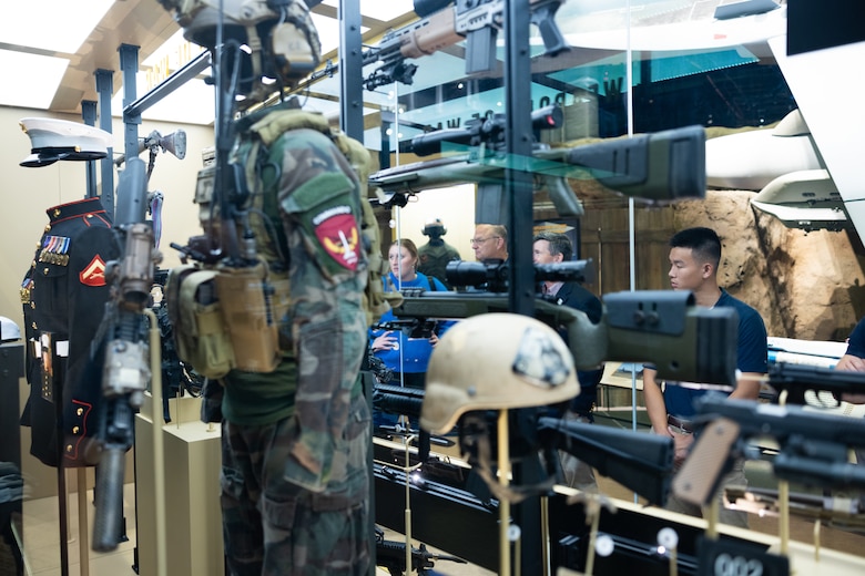 Civilians look at displays at the National Museum of the Marine Corps in Triangle, Virginia, Oct. 6, 2024. The National Museum of the Marine Corps opened the new Forward Deployed and Iraq & Afghanistan galleries to the public.