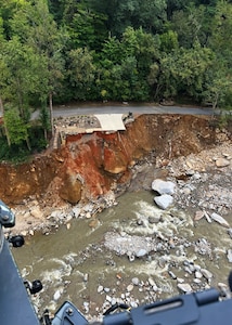 The view from an HH-60W Jolly Green II helicopter forward deployed as the 563rd Personnel Recovery Task Force, Oct. 4, 2024, in support of the U.S. Northern Command and Air Forces Northern, Defense Support of Civil Authorities Disaster Relief mission post Hurricane Helene destruction in North Carolina. Despite the impact of Hurricane Helene, U.S. Northern Command has well-established contingency plans that account for natural and man-made events and allows the DoD to execute its homeland defense mission without interruption (Courtesy photo)